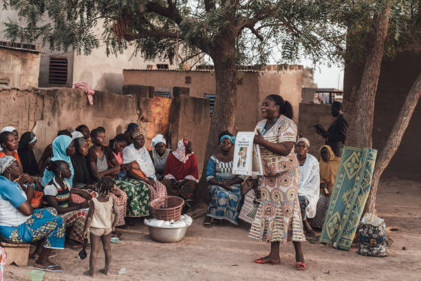 Ouagadougou, Burkina Faso. December 16, 2017. A group of people is sitting in a village square near the state capital